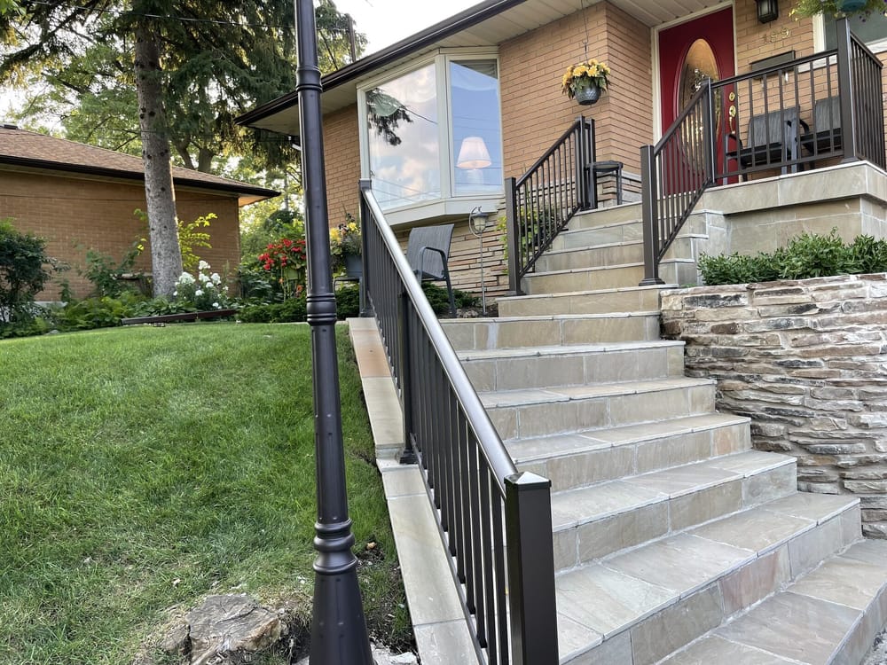 Stone steps with black aluminum railing