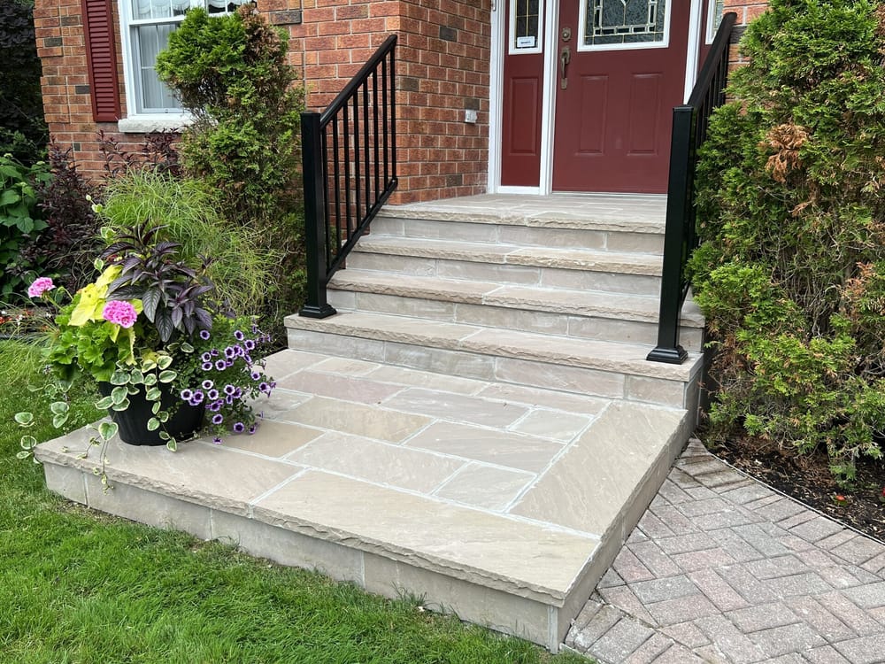 Natural stone steps with iron railing