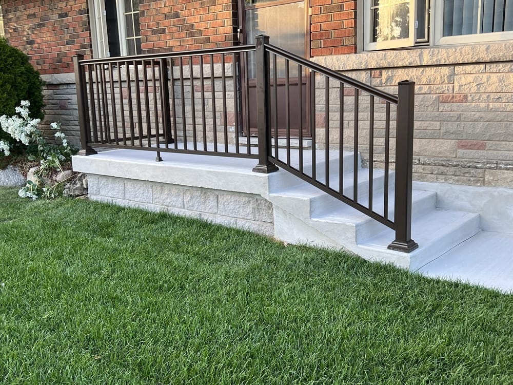 Stone porch with bronze picket railing