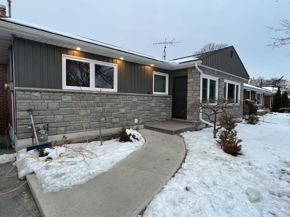 Exterior renovation with stone and siding