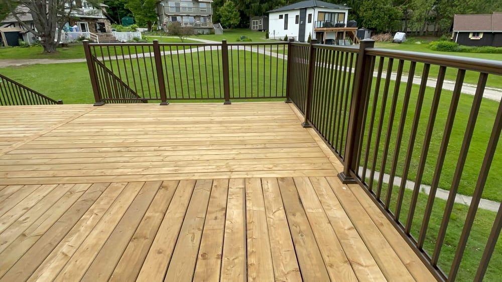 Cedar deck surface with bronze picket railing