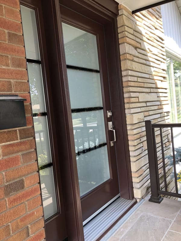 Modern front door with stone surround