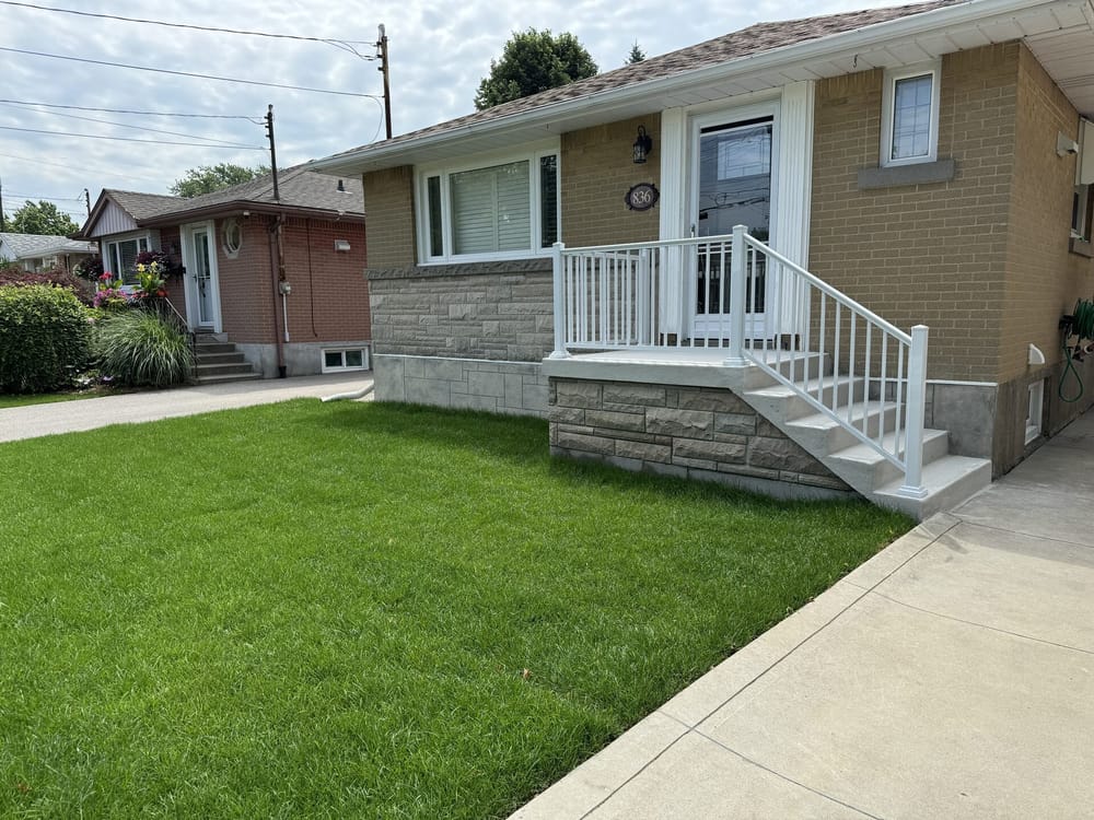 Stone porch with white railing